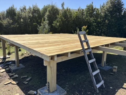Custom-built wooden deck platform on timber posts
